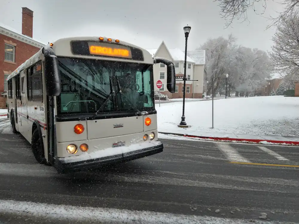 A University of Utah campus shuttle bus turning left