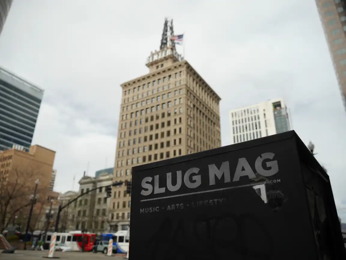 A SLUG Magazine distribution box against the Walker Center