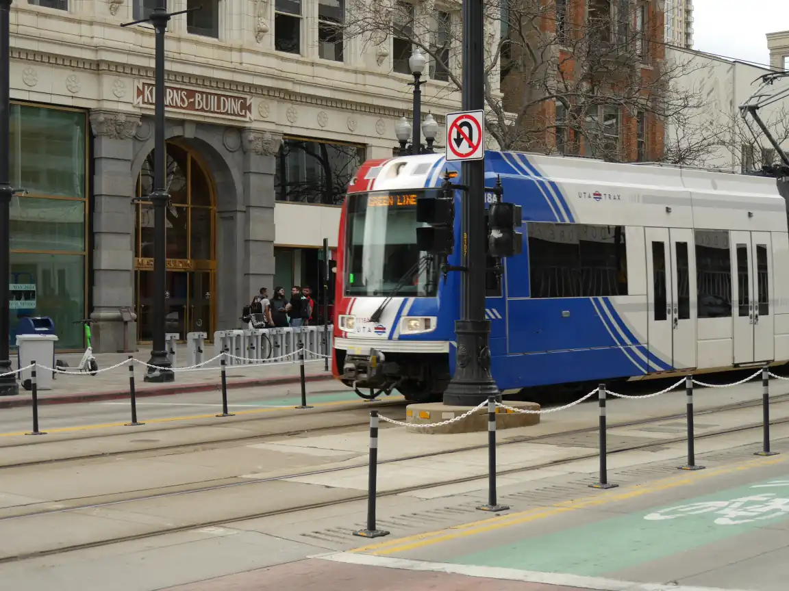 A Green Line train passing a midblock on Main St.