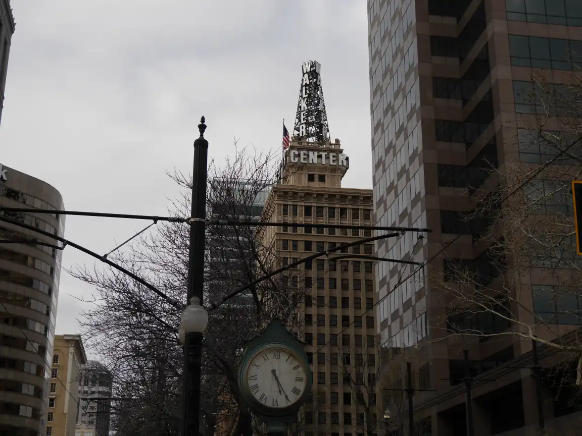 The Walker Center, framed by TRAX catenaries and a clock