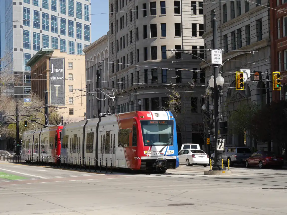 A Green Line train in the street