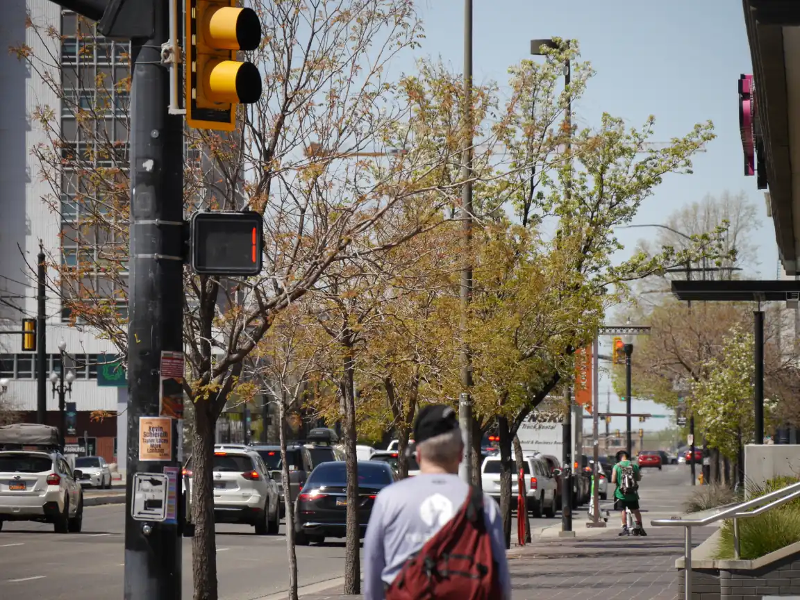 View down 400 S focused on a crosswalk timer with one second remaining