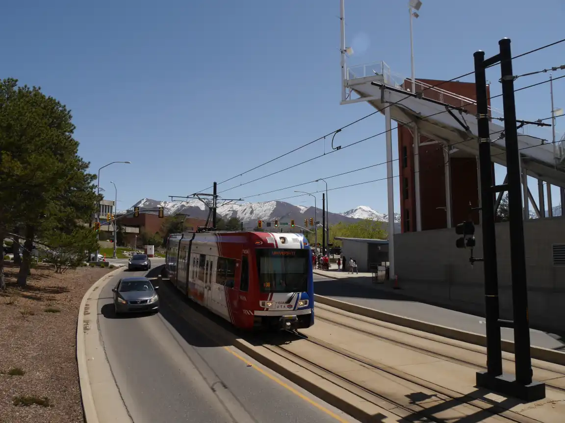 A Red Line train descending next to the stadium