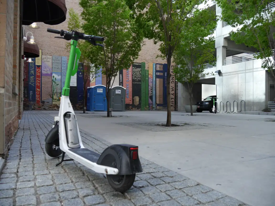 A scooter in front of the book mural